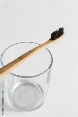 Wooden toothbrush on a glass