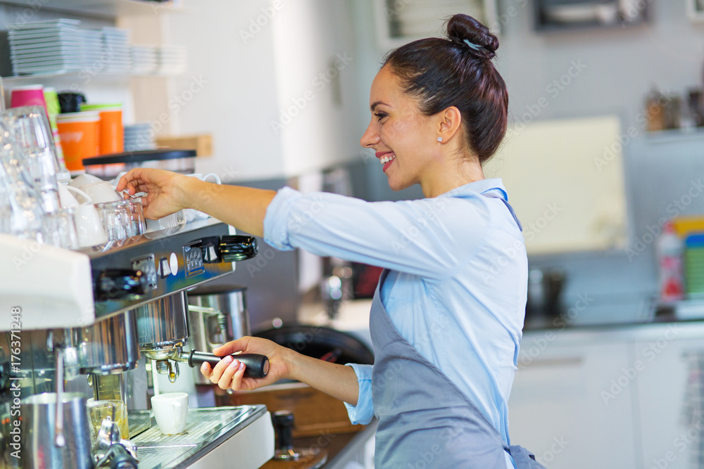 Female barista making coffee
Female barista making coffee