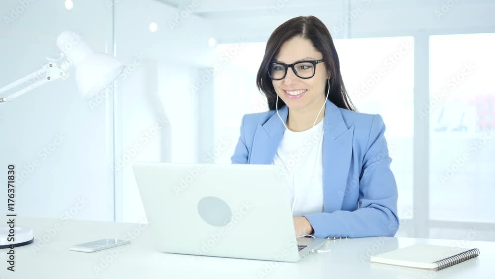 Young Businesswoman Busy Online Video Chat on Laptop at Work Young Businesswoman Busy Online Video Chat on Laptop at Work