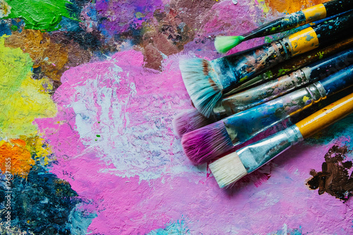 Artist brushes on canvas