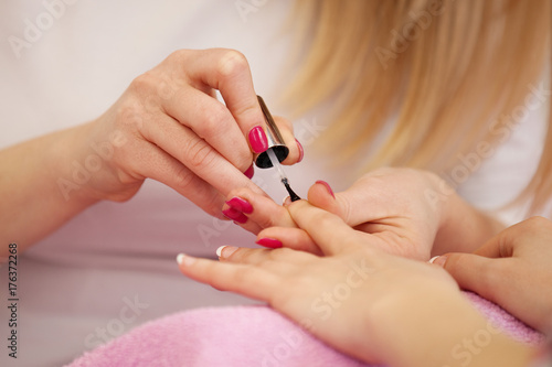 Nail polishing. Manicure Treatment. Close up.