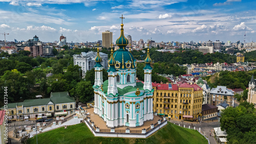 Aerial top view of Saint Andrew's church and Andreevska street from above, cityscape of Podol district, city of Kiev (Kyiv), Ukraine 