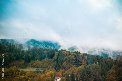 clouds and fog over the village in the mountains. autumn. Germany