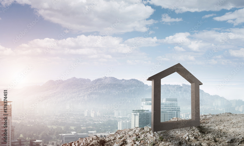 Conceptual image of concrete home sign on hill and natural landscape at background