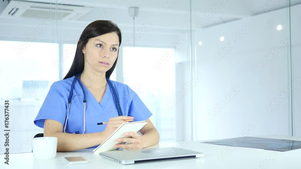 Doctor Writing Medicine for Patient, Sitting in Front Doctor Writing Medicine for Patient, Sitting in Front