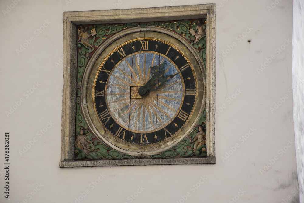 Old wooden clock on the side of a wall