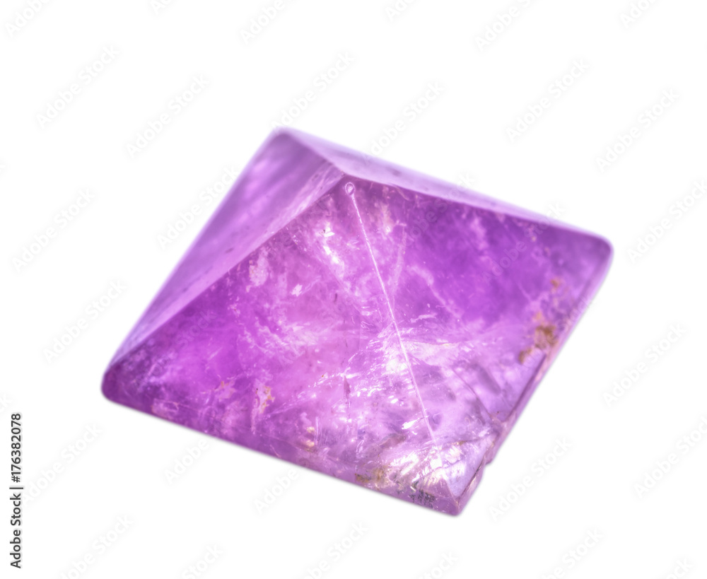 The semi-precious stone Amethyst, polished, on a white background.