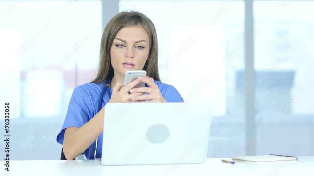Female Doctor Using Smartphone in Laboratory Female Doctor Using Smartphone in Laboratory