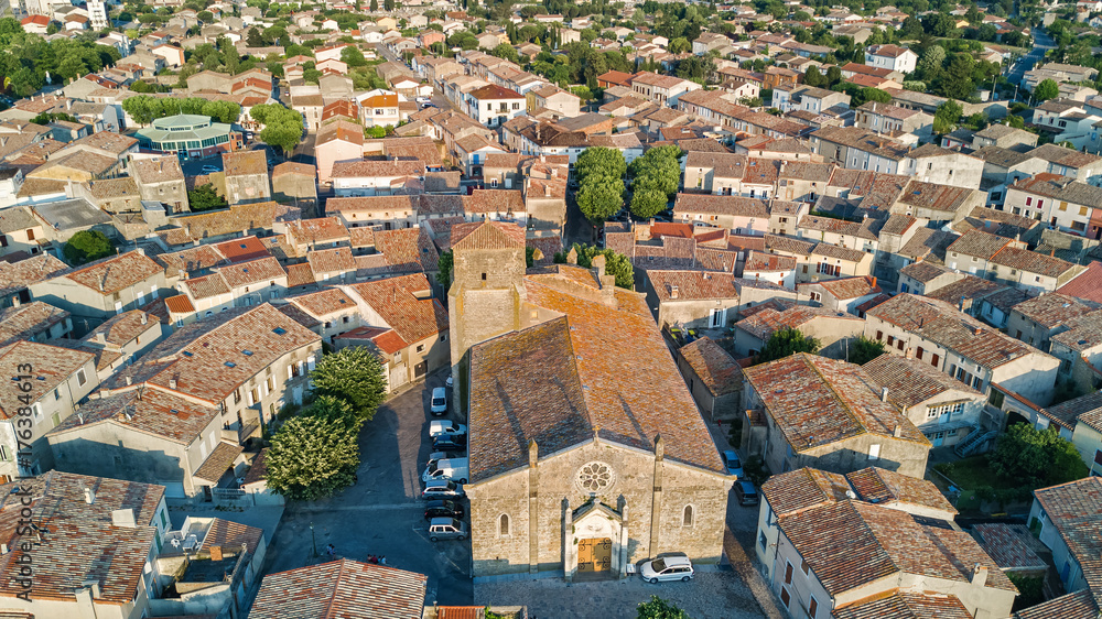 Aerial top view of Bram medieval village architecture and roofs from above, Southern France
