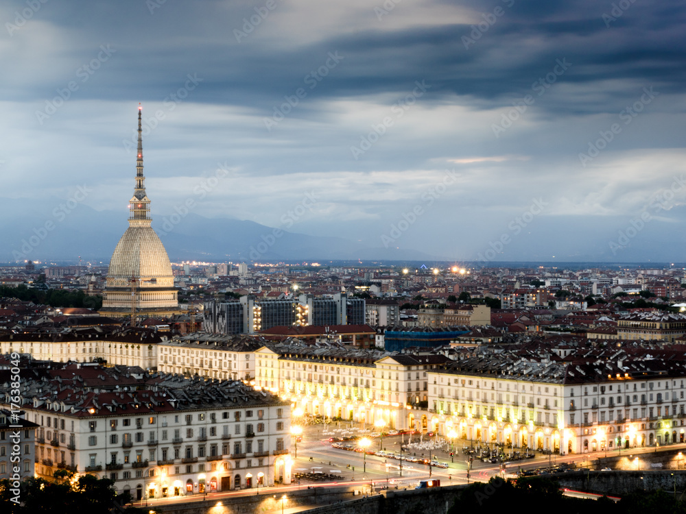 Cityscape of Torino (Turin, Italy) at sunset cloudy sky