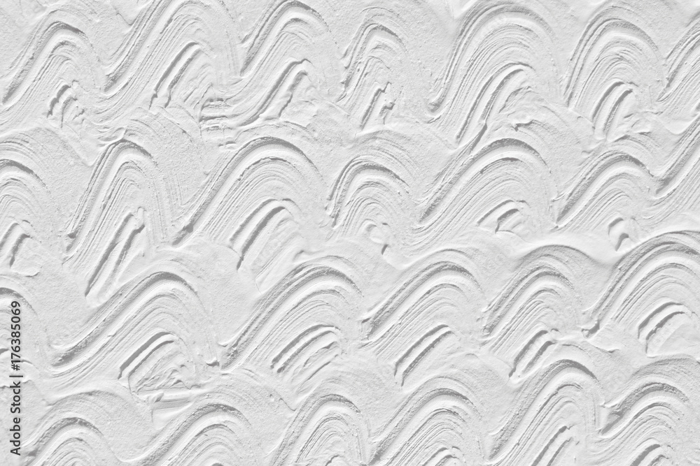 A white background with a wave pattern. Texture of the painted surface. A white background with a wave pattern. Texture of the painted surface.