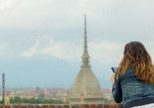 Tourist looking at turin cityscape