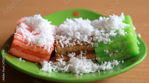 Getuk lindri. Indonesian traditional food. Steam cassava cake sprinkled with coconut photo