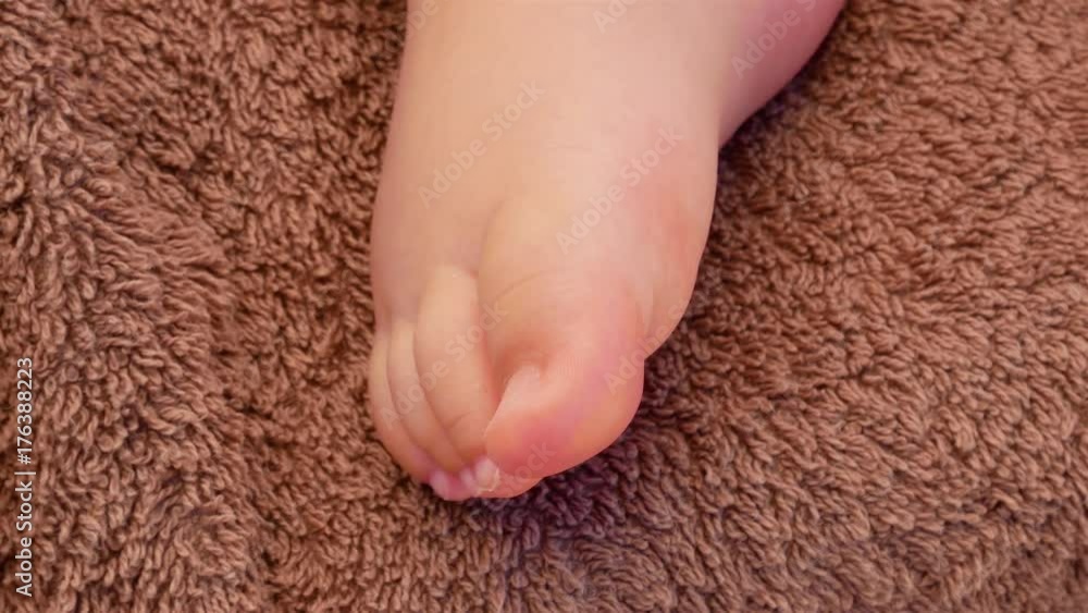 Baby legs on a brown blanket. Family concept. Beautiful conceptual video of Maternity. 4k video Baby legs on a brown blanket. Family concept. Beautiful conceptual video of Maternity. 4k video