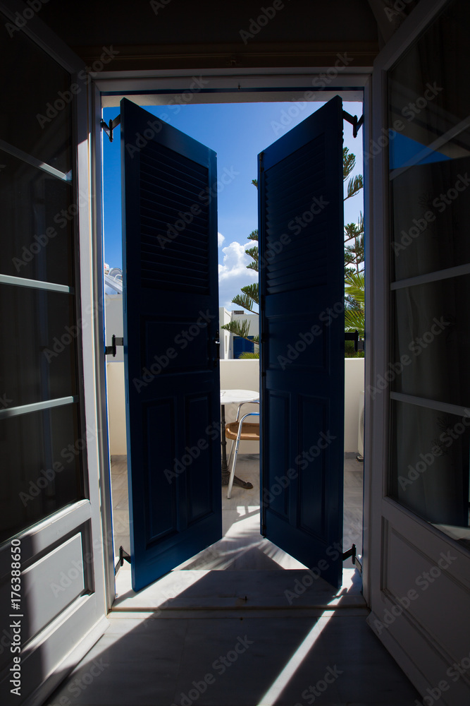 Blue door and window with shutters Blue door and window with shutters