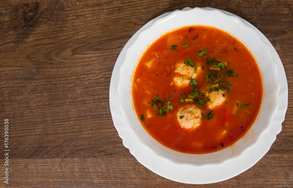 meatball tomato soup on a wooden background. with copy space. top view