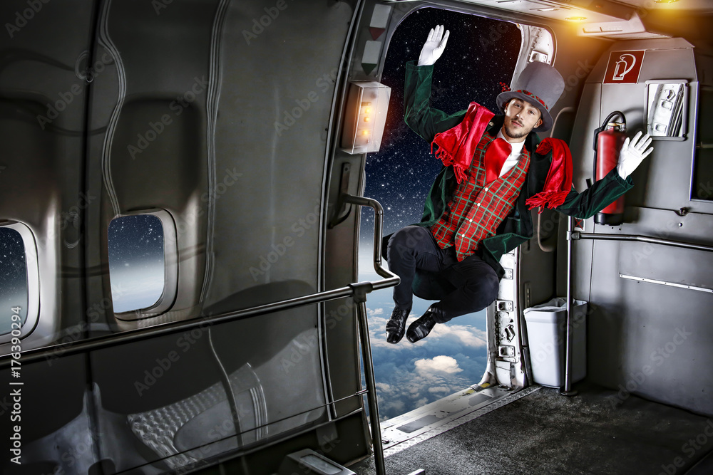 Naklejka premium christmas time and man jup off the plane 