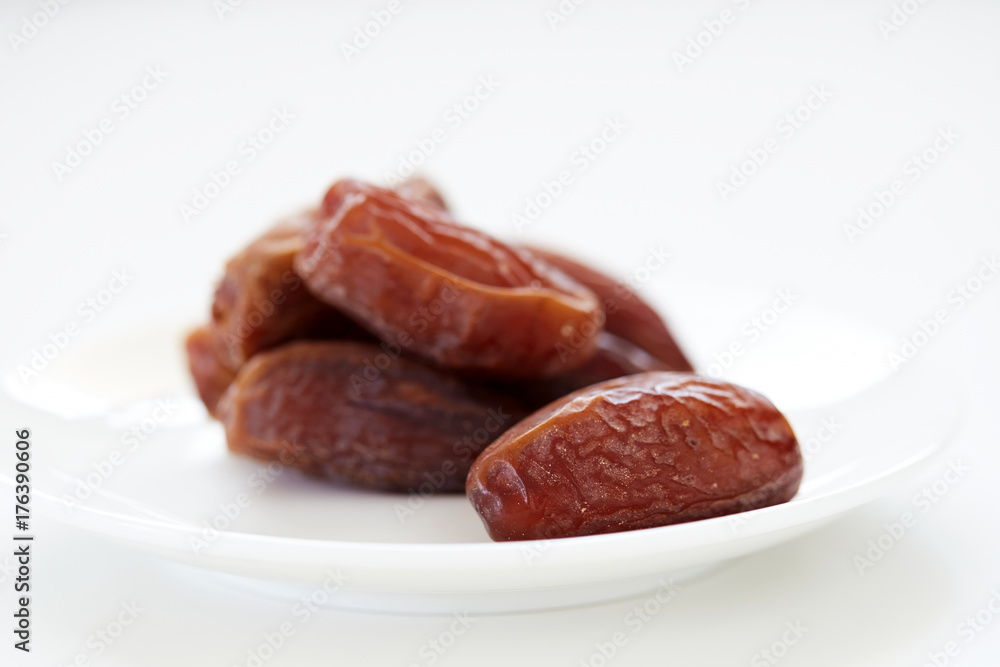 Dried Dates Fruits on dish white background