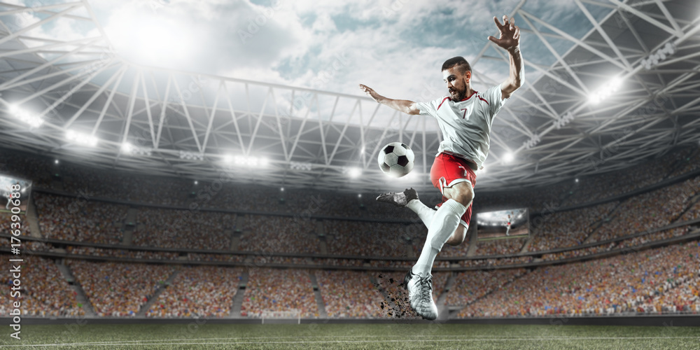 Soccer player performs an action play and beats the ball on a professional stadium. Player wears unbranded sport uniform. - obrazy, fototapety, plakaty 