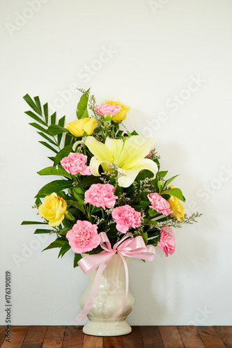 Wallpaper Mural Bouquet of flowers in vase on wooden table Torontodigital.ca