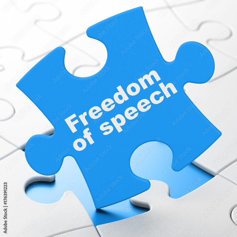 Political concept: Freedom Of Speech on puzzle background Political concept: Freedom Of Speech on puzzle background