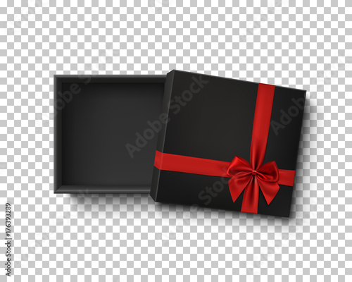Opened black empty gift box with red ribbon.