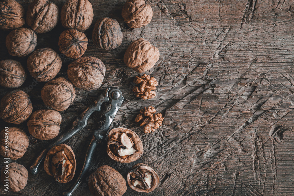 walnuts on a wooden rustic table walnuts on a wooden rustic table