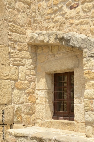 Window on stone house in Pals, Girona, Spain