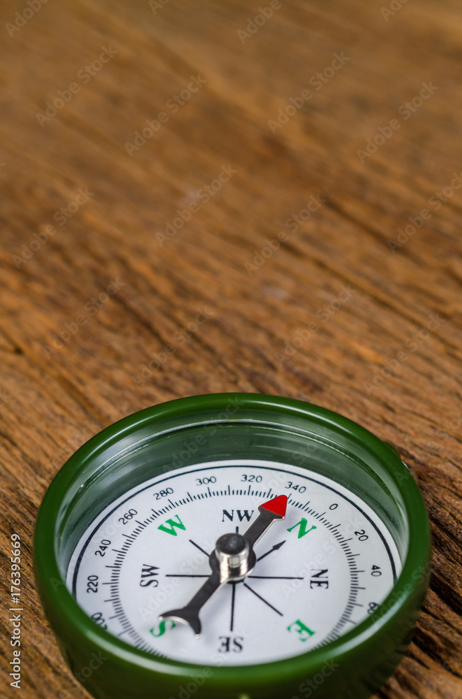 magnetic compass on wooden board magnetic compass on wooden board