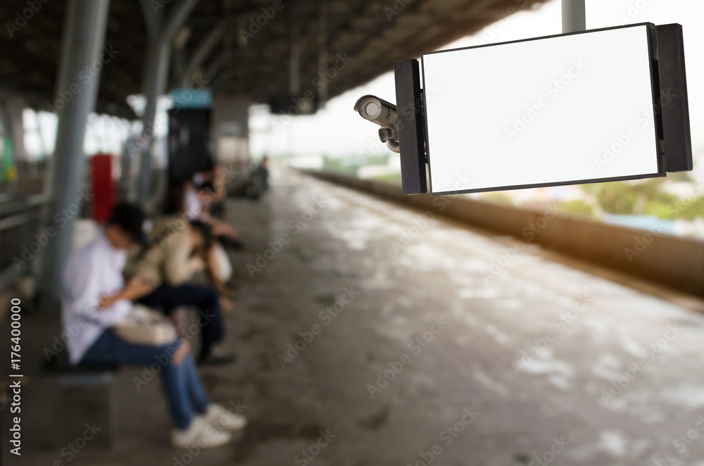 CCTV and LCD TV with white blank screen or billboard copy space for advertising or media and content with people waiting for sky train at station, transportation, commercial and marketing concept CCTV and LCD TV with white blank screen or billboard copy space for advertising or media and content with people waiting for sky train at station, transportation, commercial and marketing concept