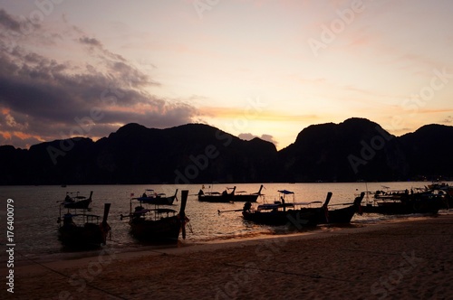 Longtail boats at sunset