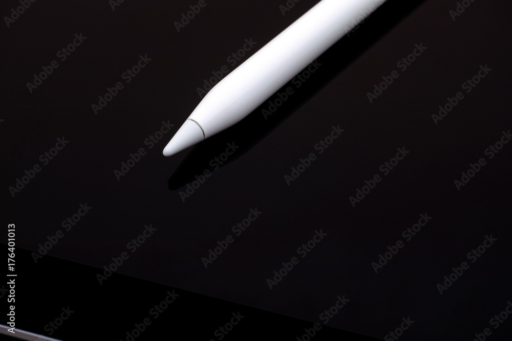 White digital pencil on digital tablet. White digital pencil on digital tablet.
