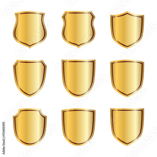 Gold shield shape icons set. 3D golden emblem signs isolated on white background. Symbol of security, power, protection. Badge shape shield graphic design Vector illustration