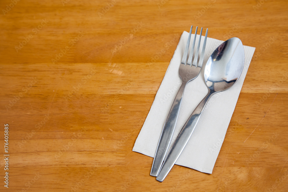 Cutlery spoon fork on the wood table in resturant Cutlery spoon fork on the wood table in resturant