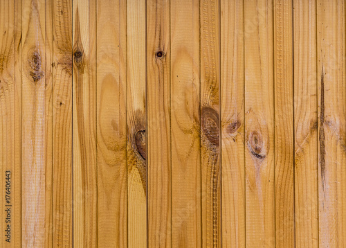 Vertical board beige warm light wooden background texture with annual rings