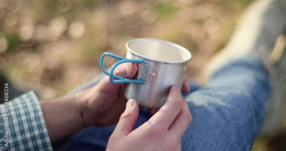 man relaxing hands with empty glass detail around fire place close.real friends people outdoor camping tent vacation in autumn trip.Fall sunny day in nature, togetherness and friendship. 4k video man relaxing hands with empty glass detail around fire place close.real friends people outdoor camping tent vacation in autumn trip.Fall sunny day in nature, togetherness and friendship. 4k video