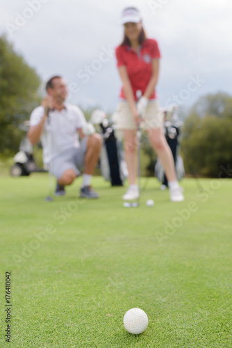 husband praising the wife on golf improvement