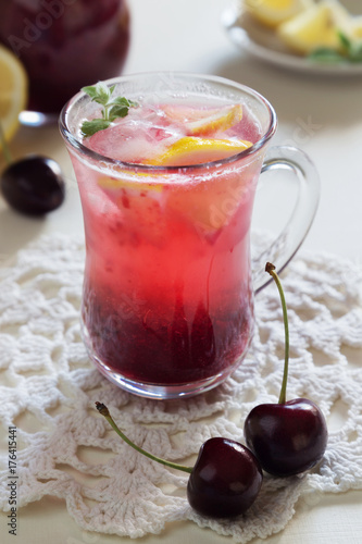 Homemade cherry lemonade with soda in glasses