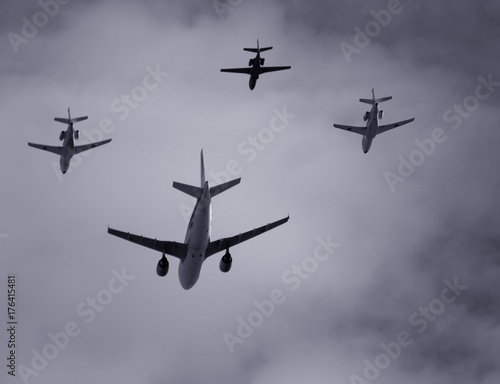 group of four planes flying together in formation