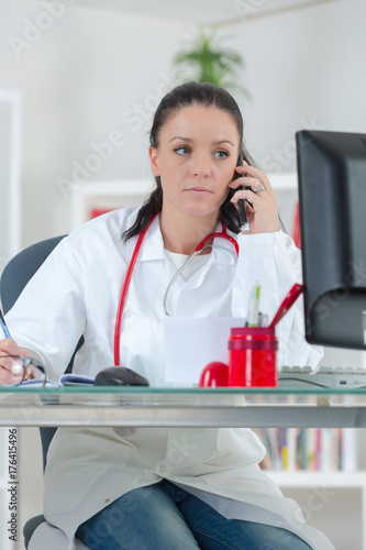 portrait of female doctor talking on the phone