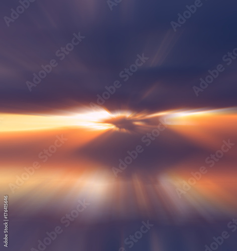 Fototapeta Naklejka Na Ścianę i Meble -  Abstract bright rays of the sun through thunderclouds over the water.