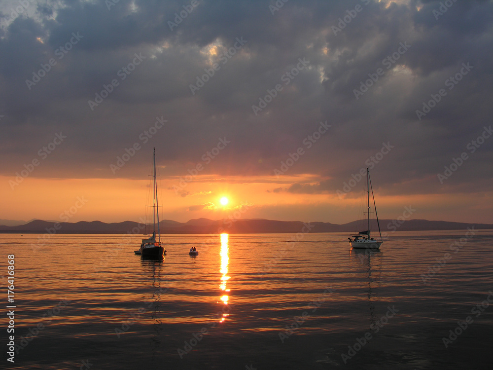 Boats at anchor at sunset
