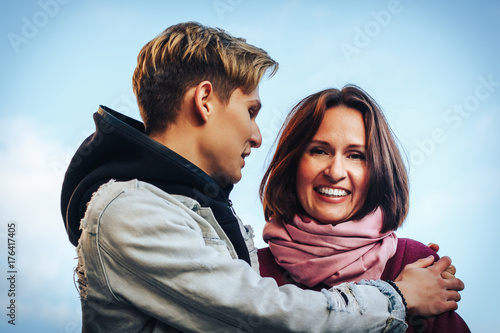 Young mother and adult son outdoor in a autumn