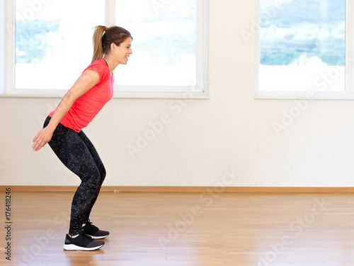 Active young woman exercising