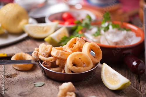 Fried calamari squid on wooden table