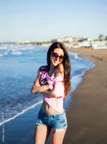 A wonderful girl posing on the beach
