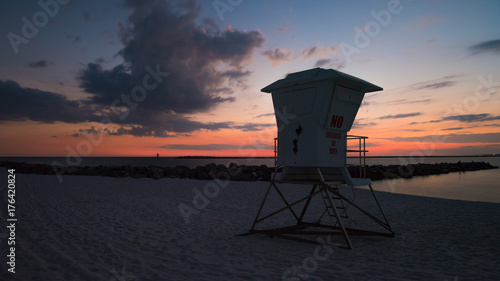Sunset at the beach with lifeguardhouse