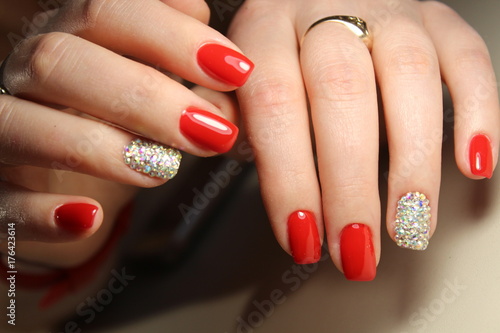 Fotografie, Obraz Manicure design red nails with rhinestones