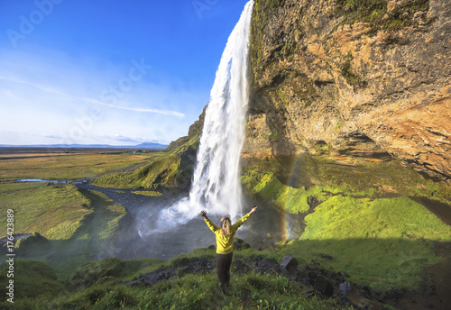 Obraz na płótnie Woman under Seljalandsfoss waterfall, Iceland
