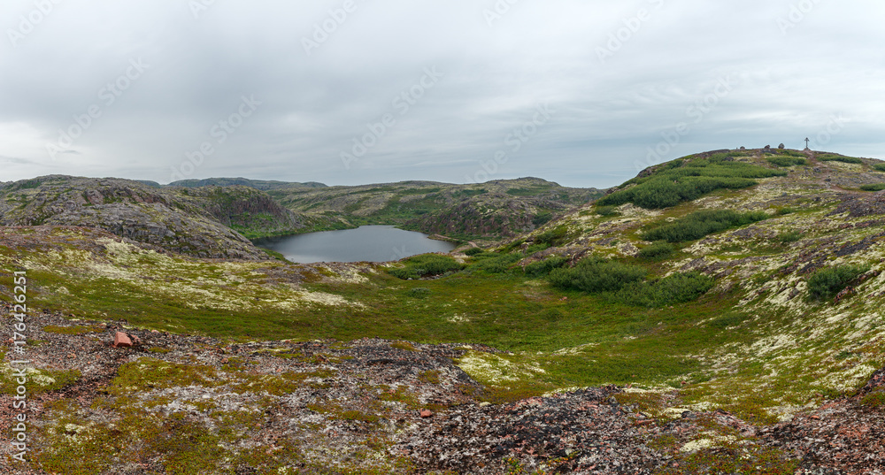 Lake with clean, fresh water on the shore of the Barents sea. Kola Peninsula , Russia.